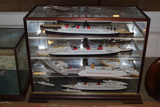 Amis Models Ltd cargo ship Port Huon, in glazed display case & a shelved display case containing cruise ships, etc